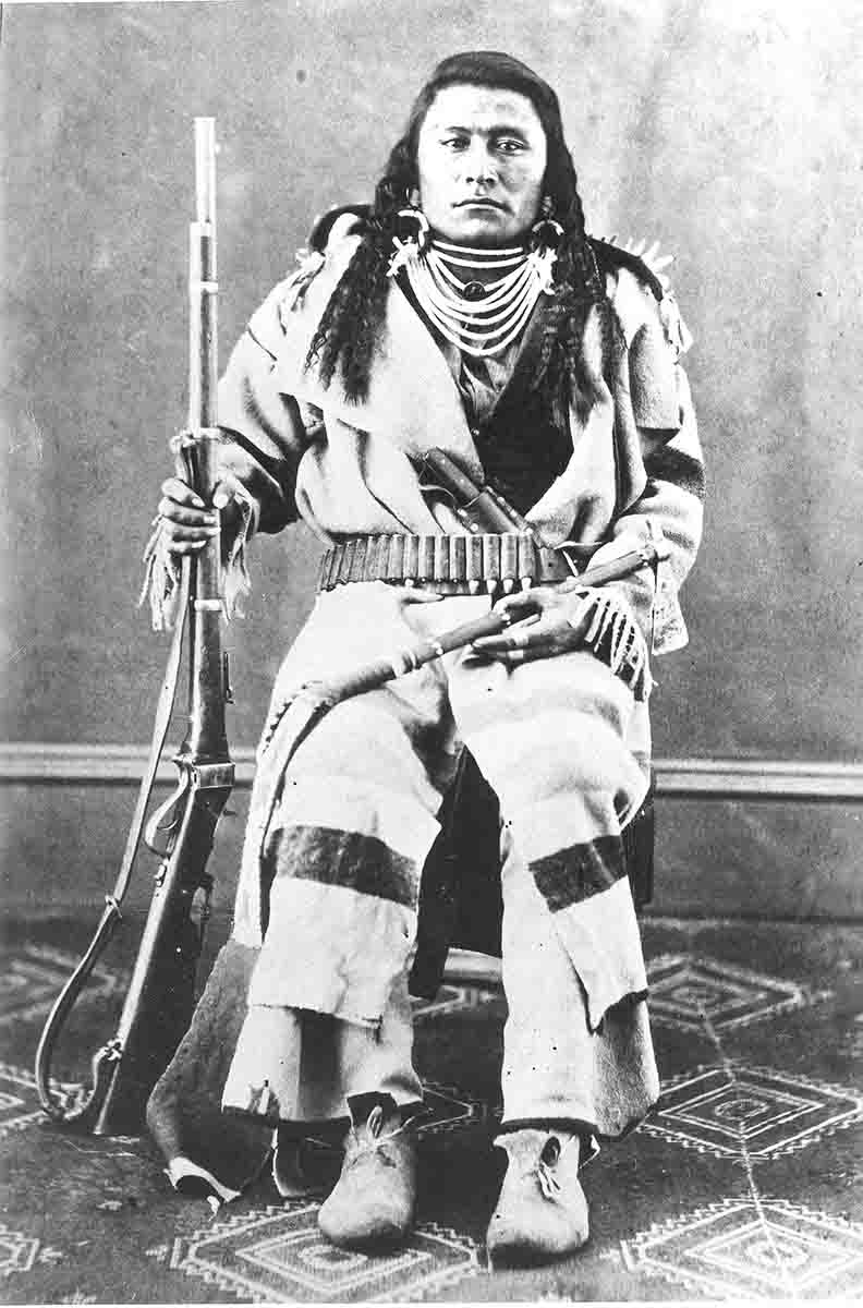 This Blackfoot warrior is shown with his Sharps military-style rifle with sling.